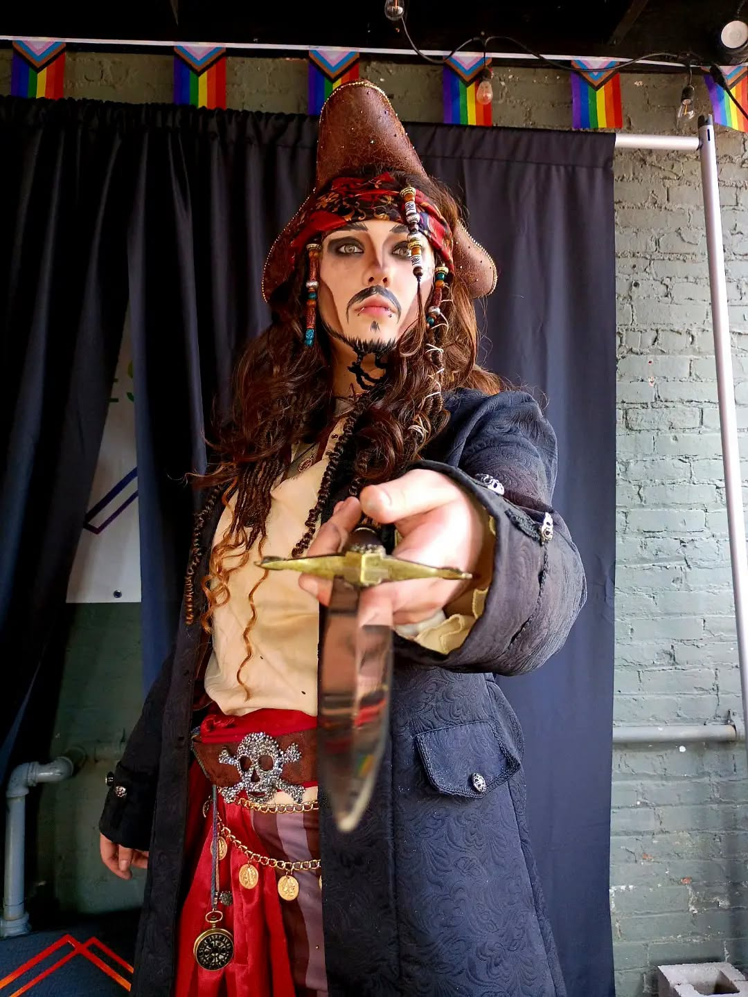 Dyke Tyson performing in a theatrical pirate drag king character costume.